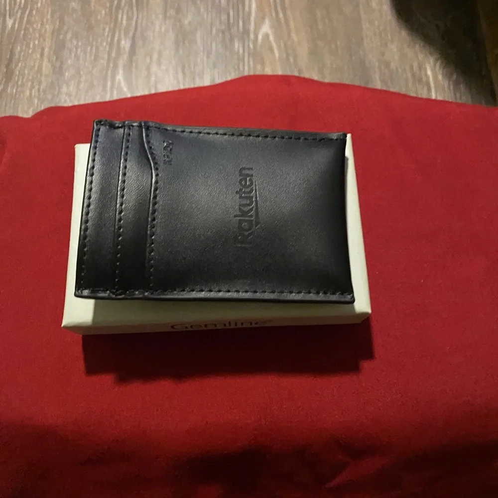 Man’s black leather money clip & card holder.